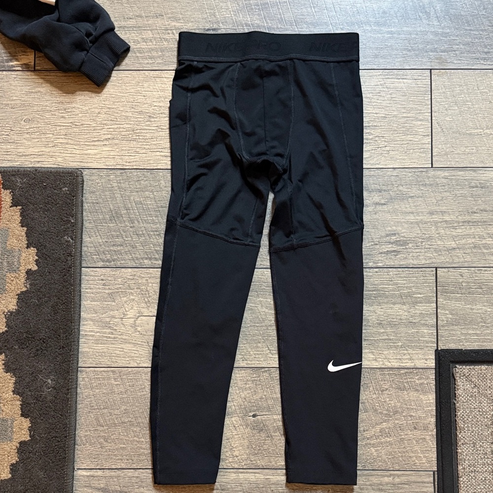 Nike Kids Black Compression Leggings with White Swoosh